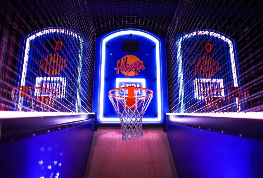 Picture of illuminated indoor basketball hoop game, where you are against a clock trying to get as many shots in before the timer runs down