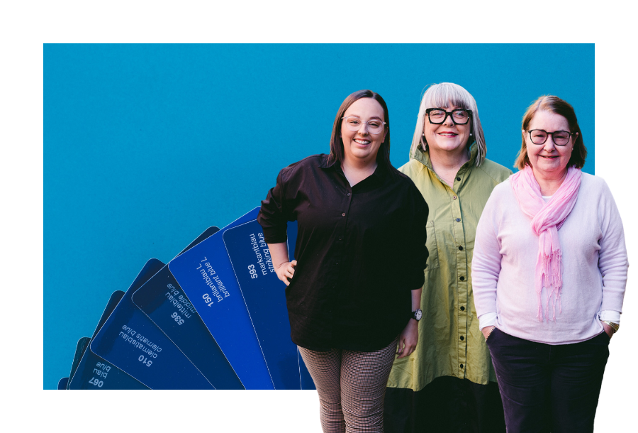 Pictured, Mekayla Lambert, Anthea Taylor and Christine Friel standing in front of a dark blue panton fan spread out against a dark blue background.