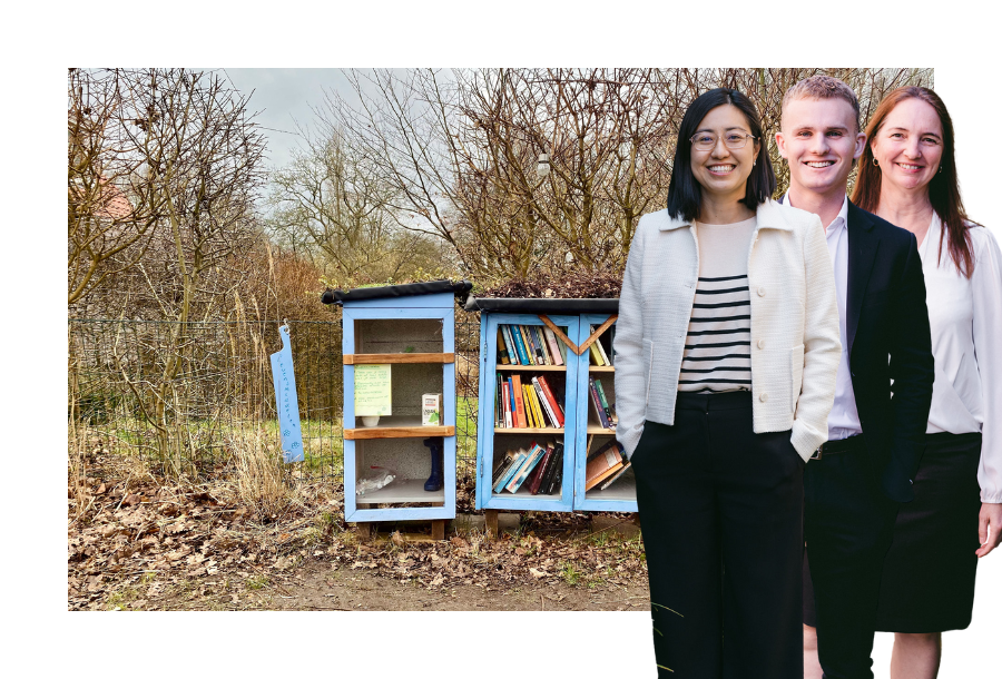 Pictured: Our Financial Advice team, Helen, Jayden and Sam standing smiling. They're standing in front of a light blue public library cabinet that stands on the side of the road.