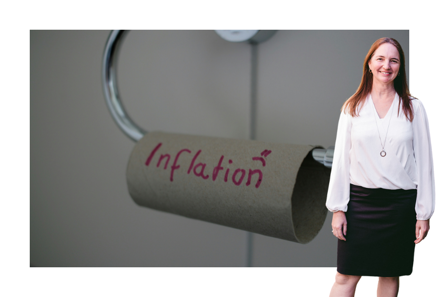 Senior Financial Adviser Samantha Butcher stands center in the photograph wearing a white long sleeve top and a black skirt. Behind her is an image of an empty toilet roll with the word "inflation" written on it in red marker with a small frowning face drawn next to it.